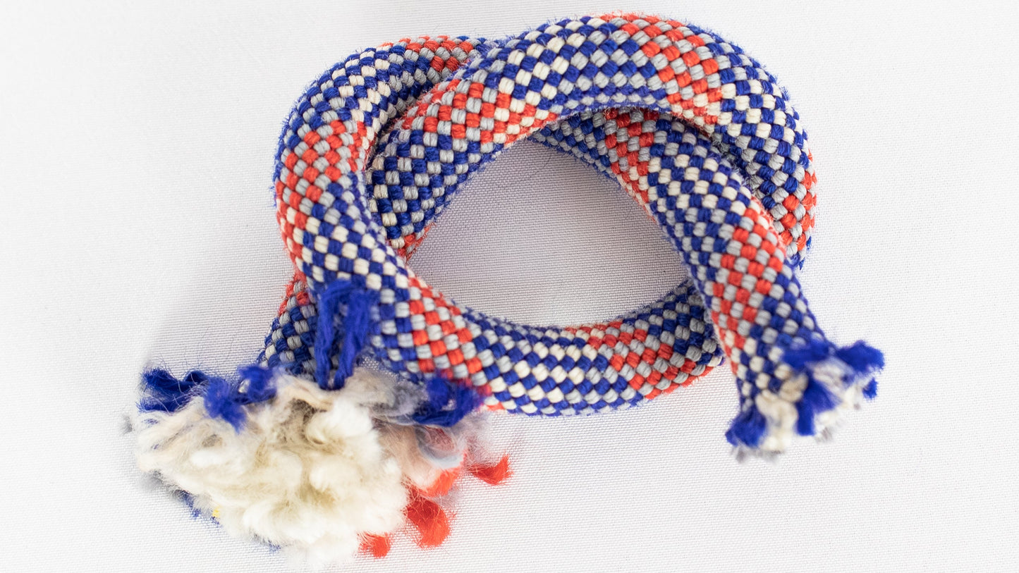 Braided cord with blue, red, and white pattern on a white background