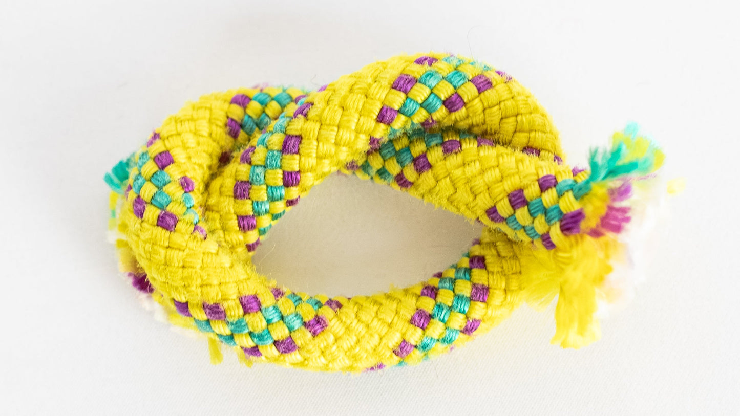 Yellow braided rope on a white background