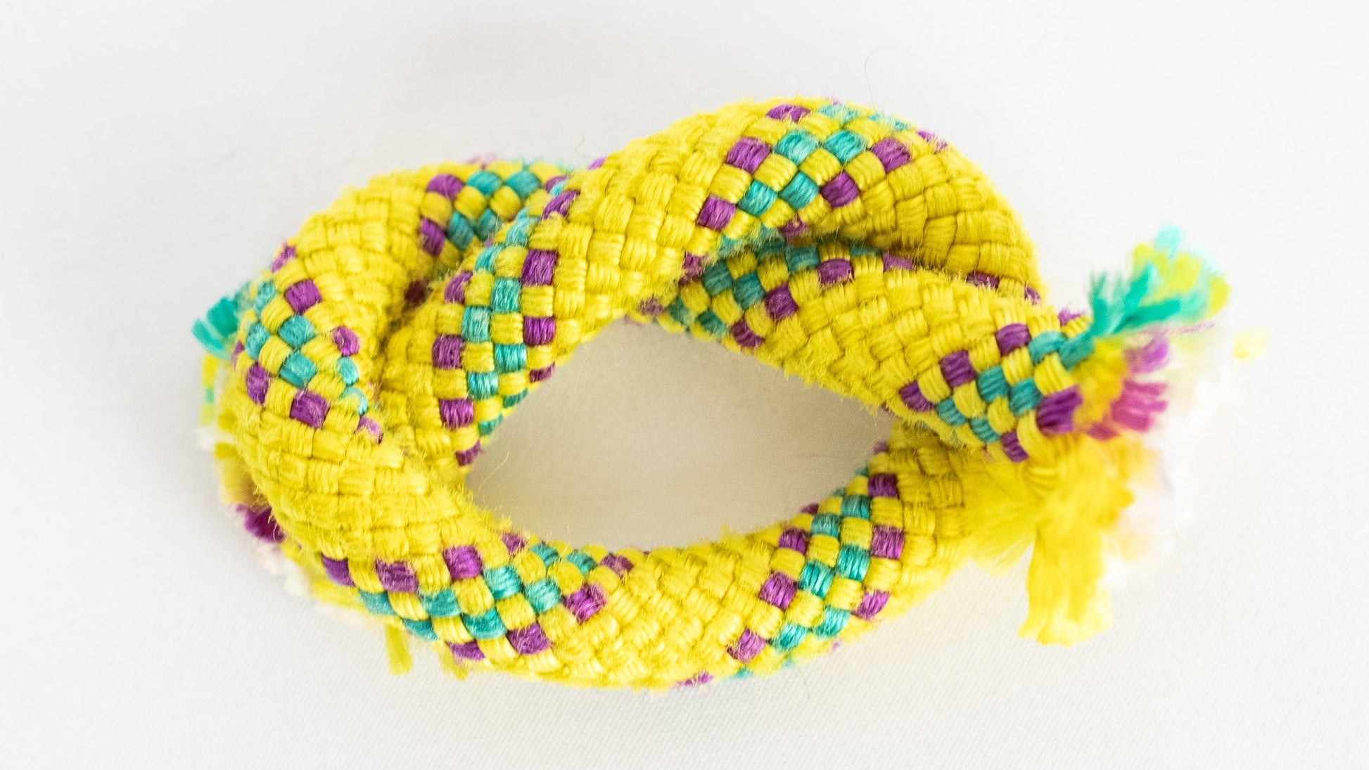 Yellow rope knot on a white background