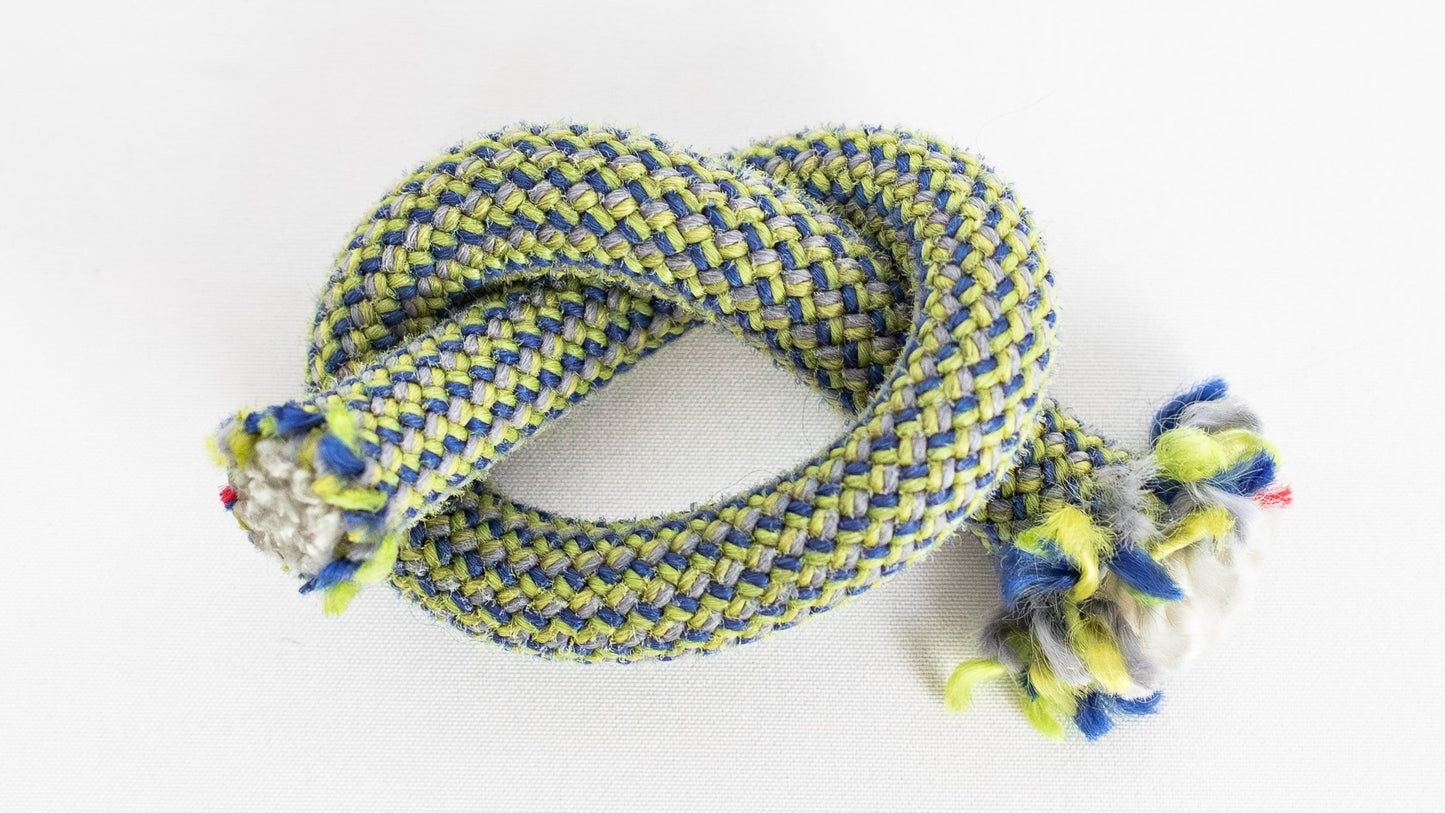 Braided rope with colorful tassels on a white background