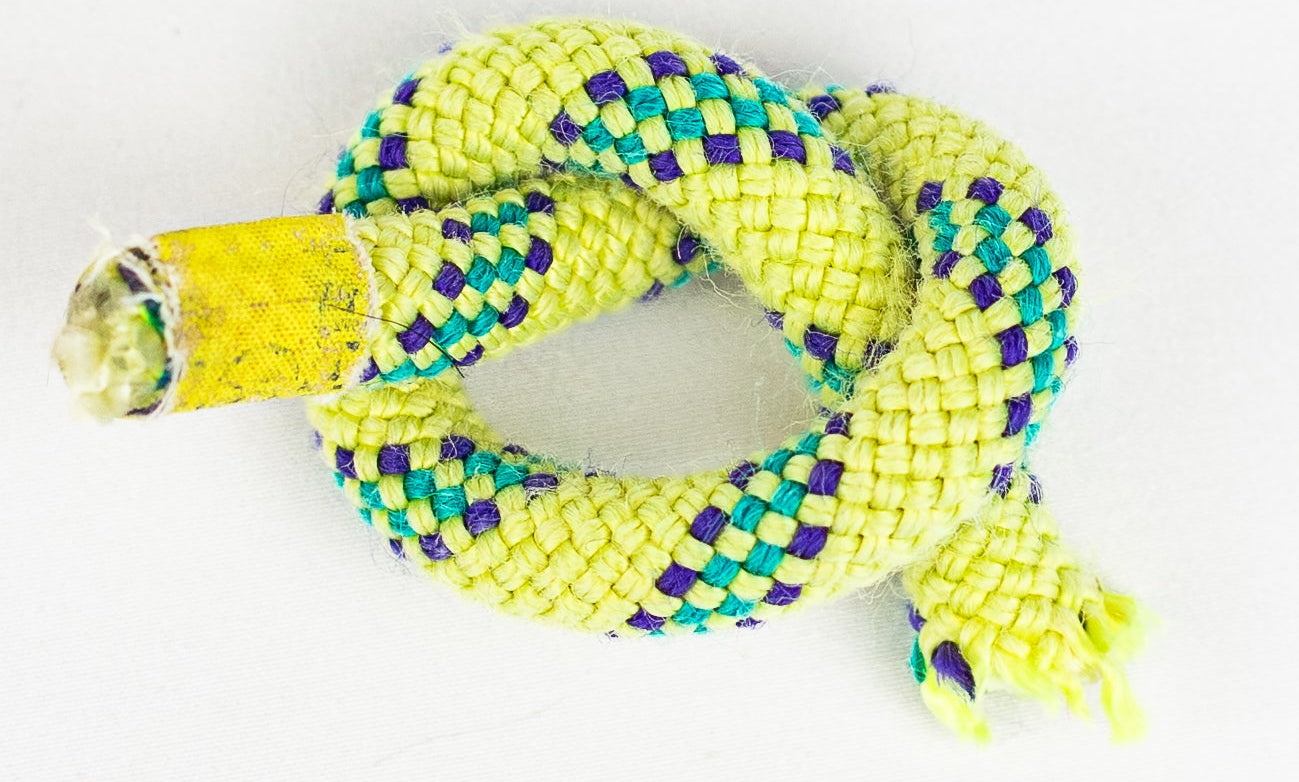 Yellow and green braided rope on a white background