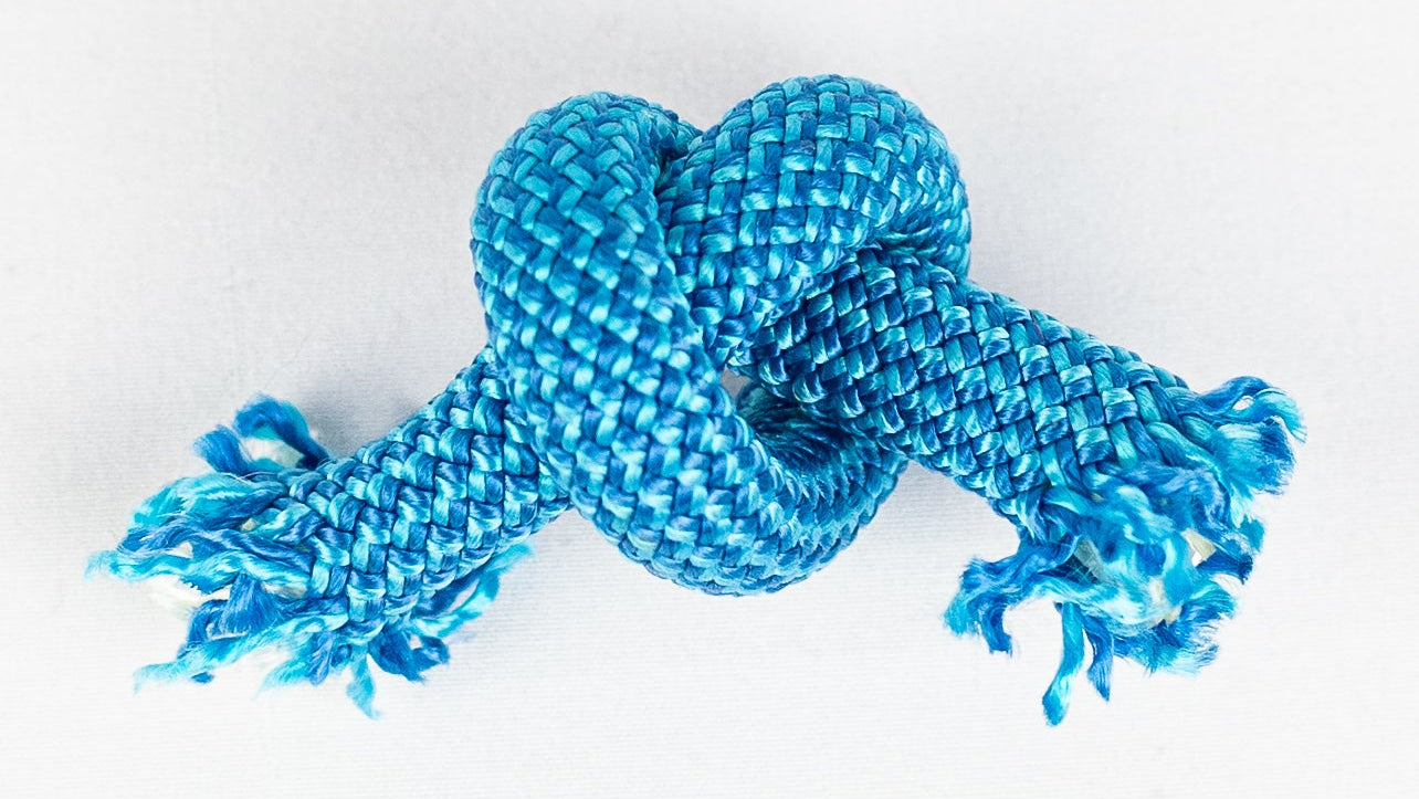 Blue knotted rope on a white background