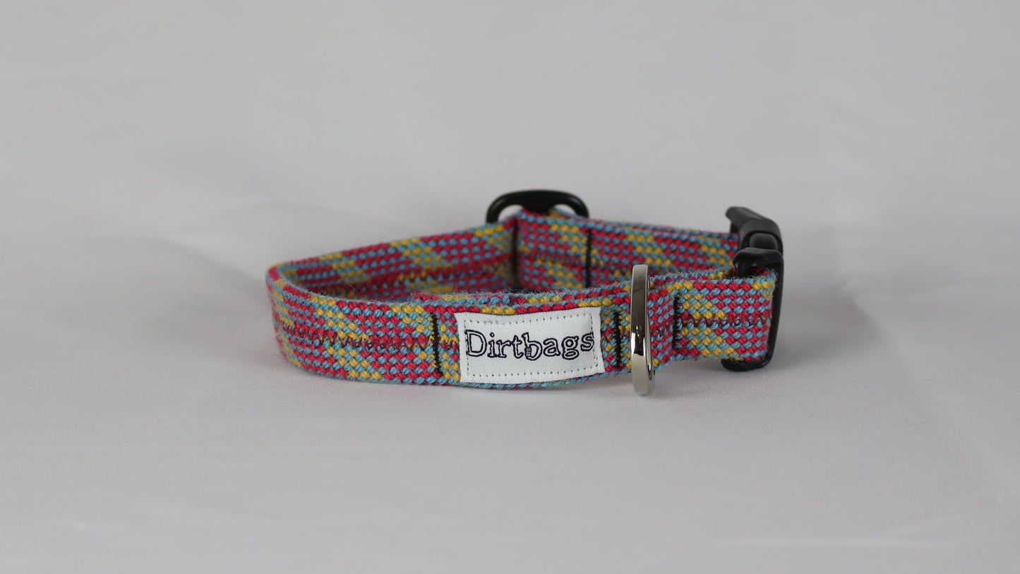 Plaid upcycled rope dog collar with a dirtbags tag on a gray background